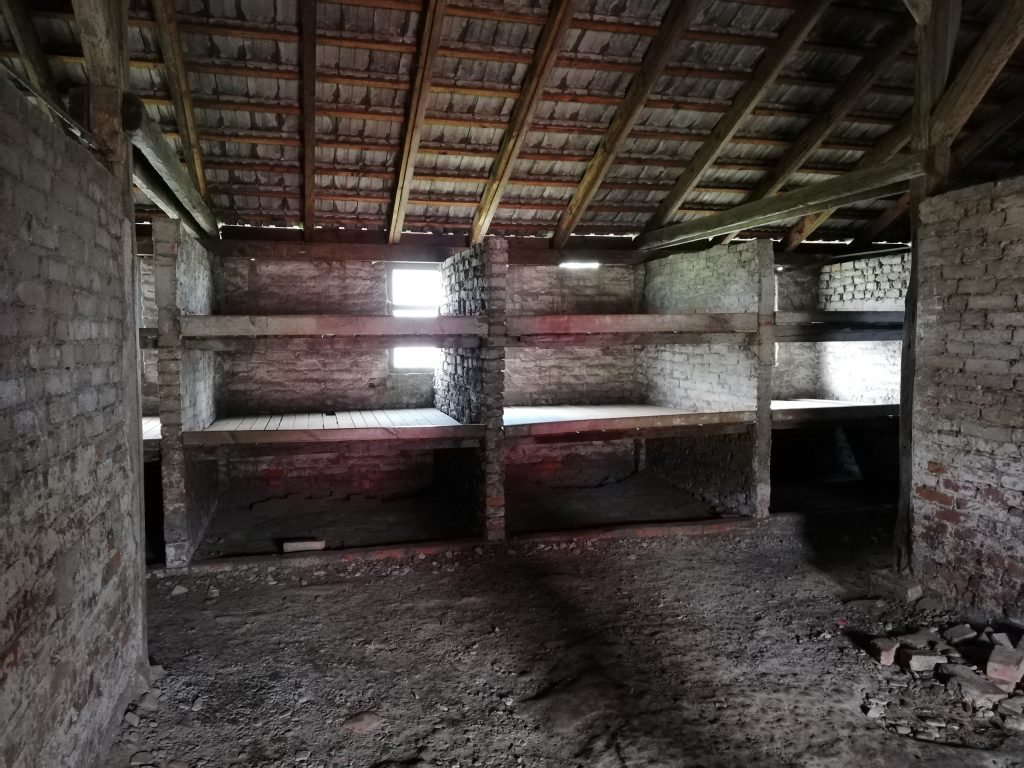 barracks in birkenau concentration camp showing prisoner sleeping pallets