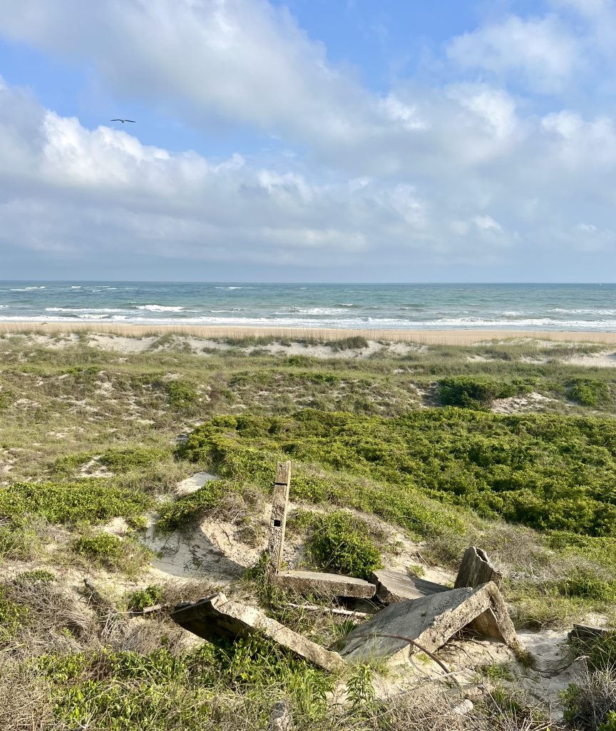 fort macon state park beach as seen from above in atlantic beach nc, with remains of a wwii bunker in the foreground
