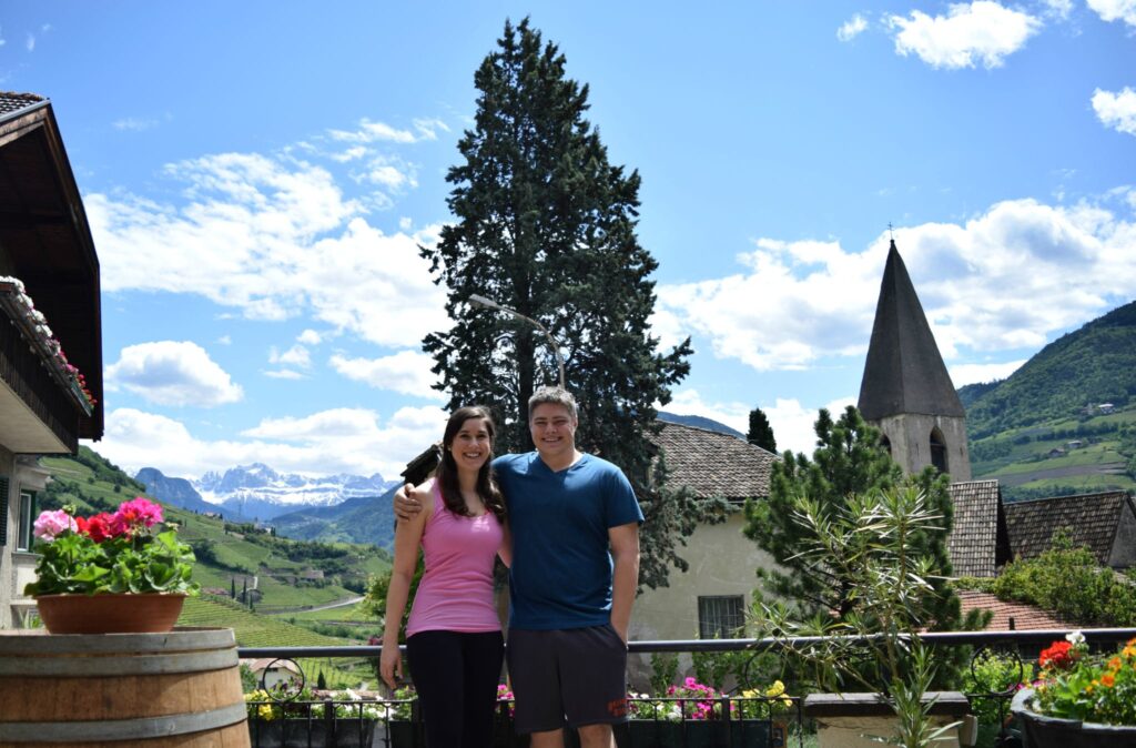 kate storm and jeremy storm at a wine tasting outside bolzano italy