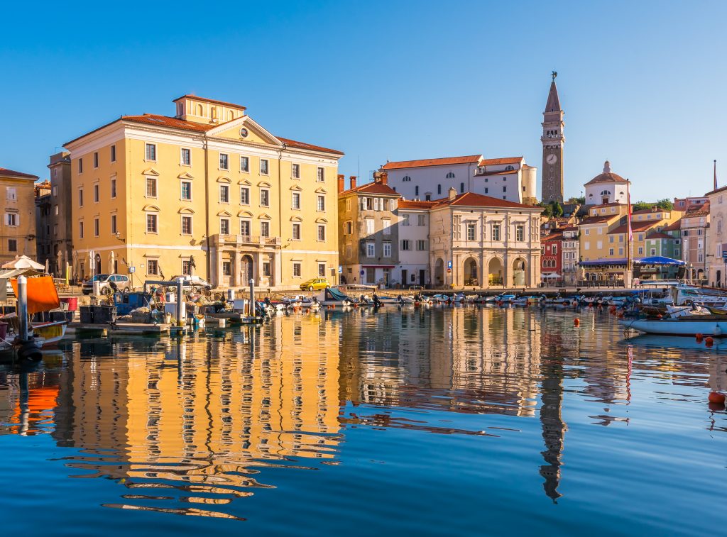 view of piran harbor at sunset