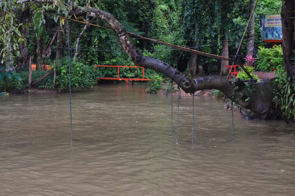 blue lagoon vang vieng during the rainy season in laos