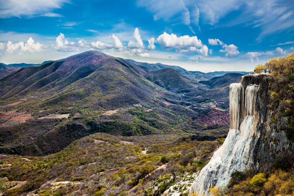 hierve el agua in oaxaca mexico with petrfied falls on the right side of the photo