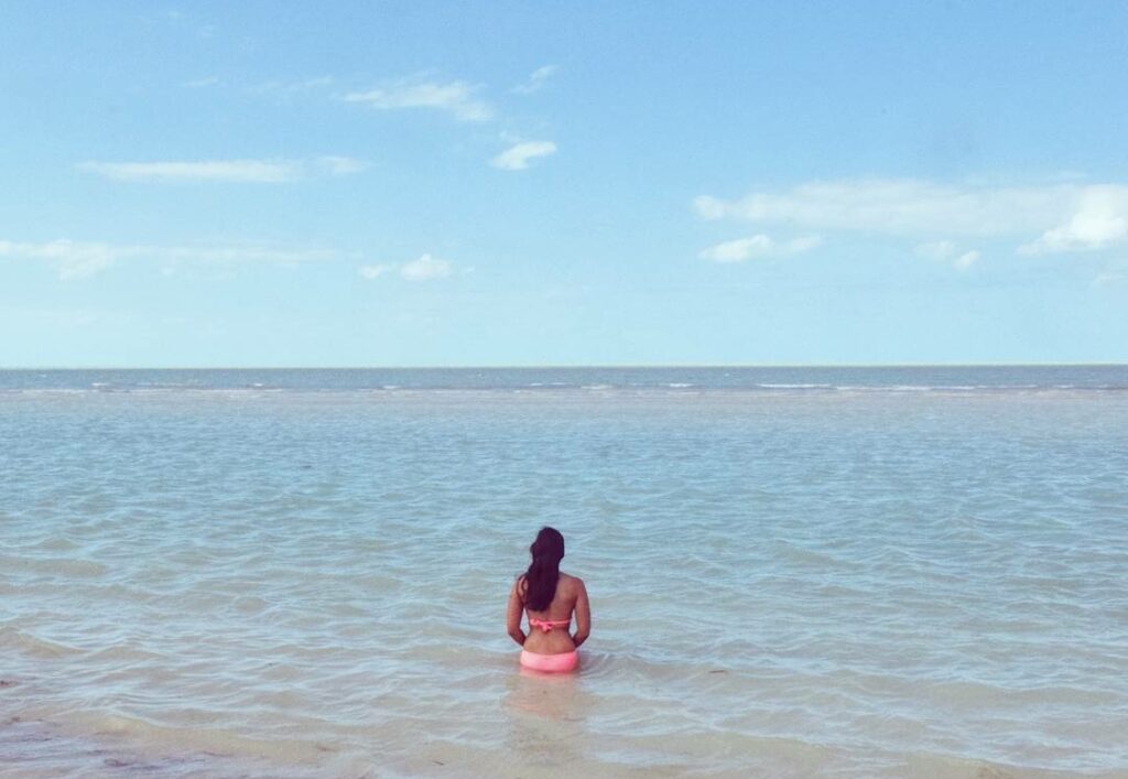kate storm sitting in the water holbox island