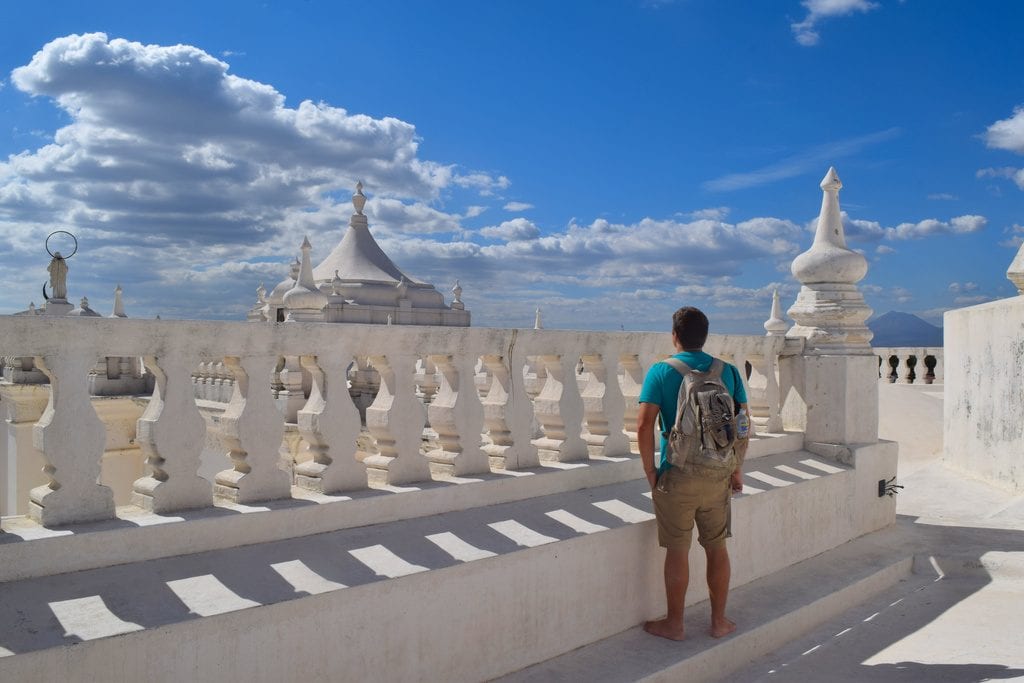 jeremy storm standing on the white roof of leon cathedral in nicaragua