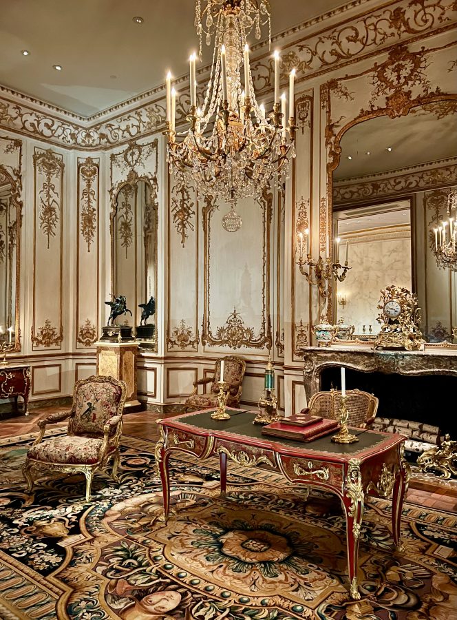 reconstructed parisian apartment in the met new york city with desk front and center and rococo details