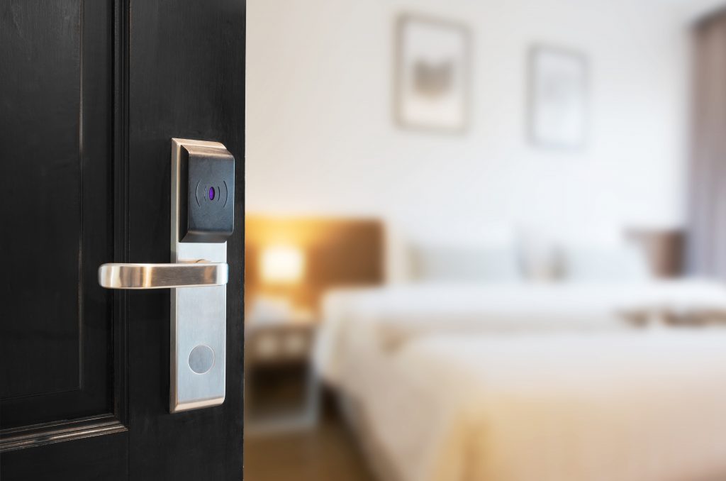 open door leading into bright and modern hotel room
