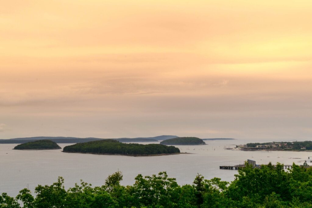 view of islands from cadillac mountain at sunset in maine