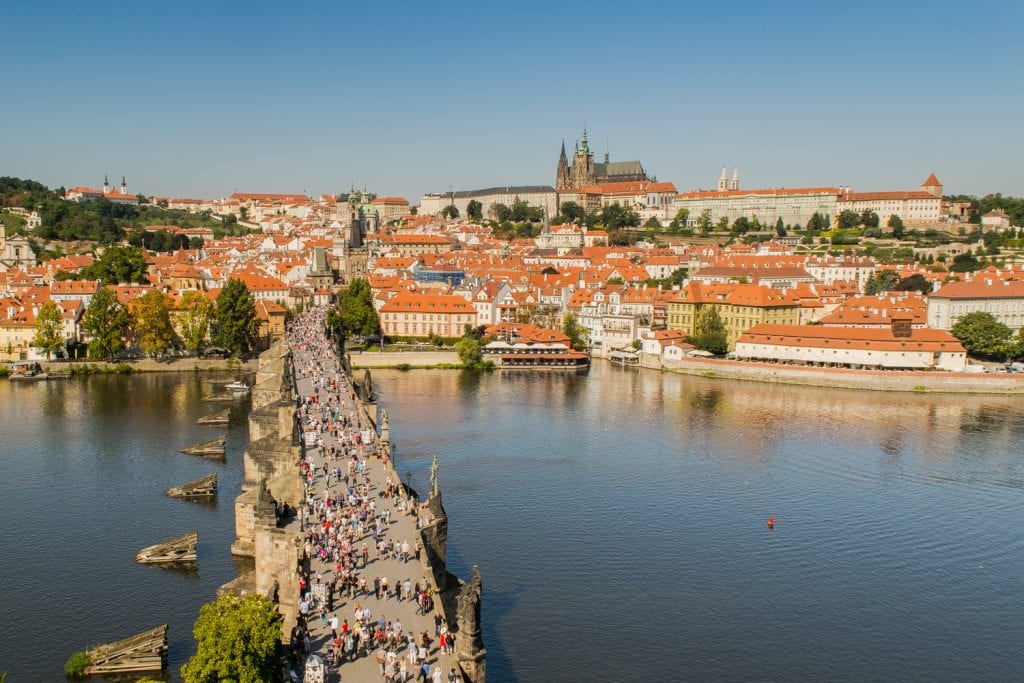 view of charles bridge and vltava river from above with st vitus cathedral visible in the distance
