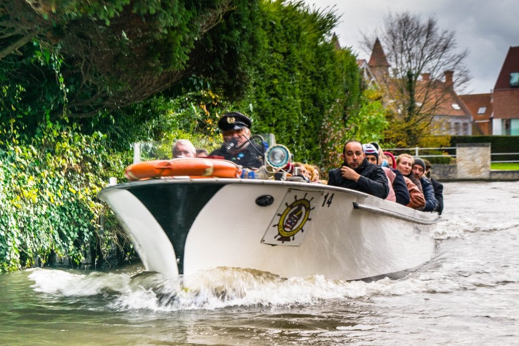 canal cruise in bruges belgium underway on a cloudy day, one of the best things to do in belgium in a few days