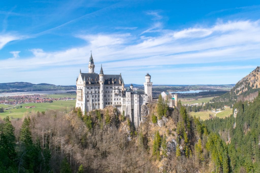 view of neuschwanstein castle from afar on a day trip from munich to neuschwanstein castle