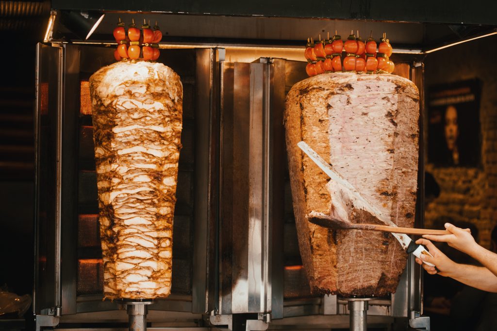 doner being trimmed with a knife in istanbul food guide