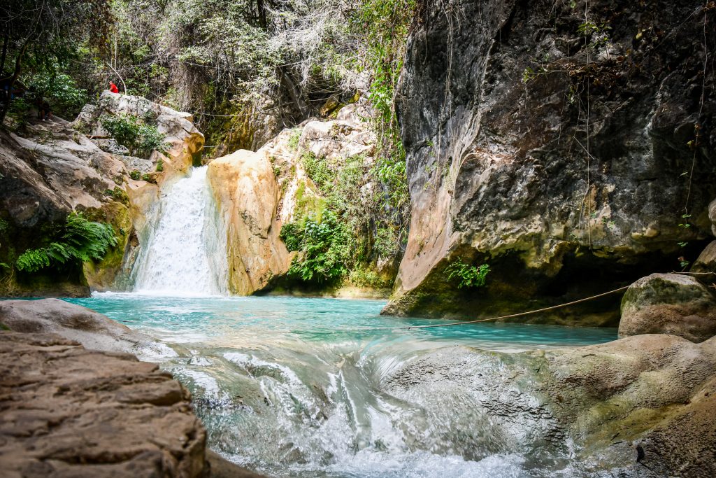 pozas azules shot with a turquoise pool in front of it