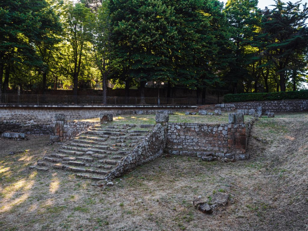 stone ruins of Temple of Belvedere shaded by trees