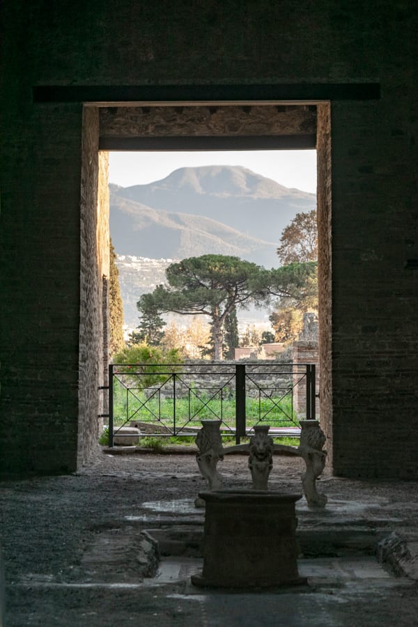 view of mount vesuvius as seen through a doorway in pompeii italy