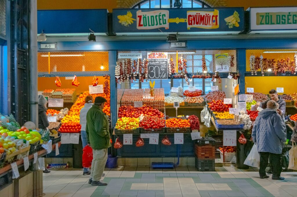 people shopping in great market hall food stalls budapest hungary