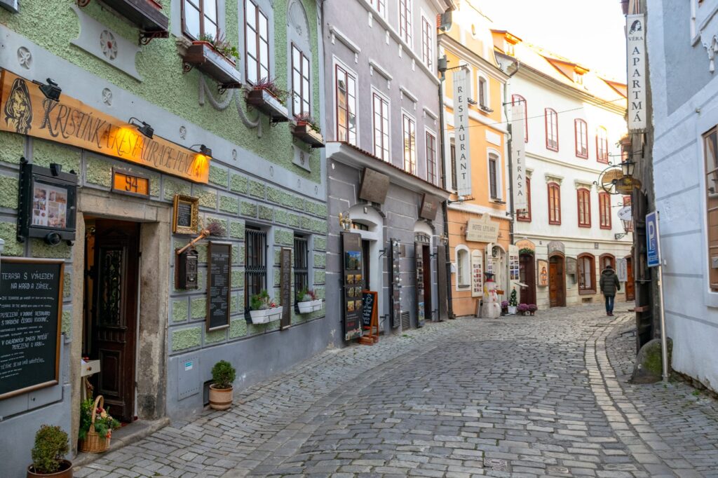 cobblestone street with colorful buildings during Winter in Český Krumlov