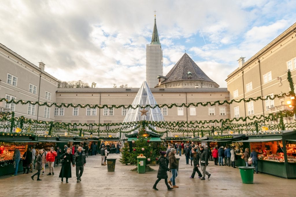 view of the christmas market at salzburg cathedral in december