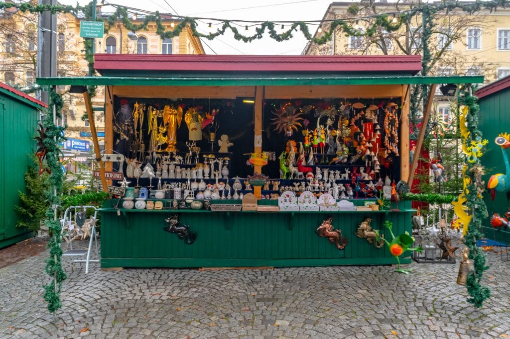 christmas market stall selling crafts during december salzburg austria