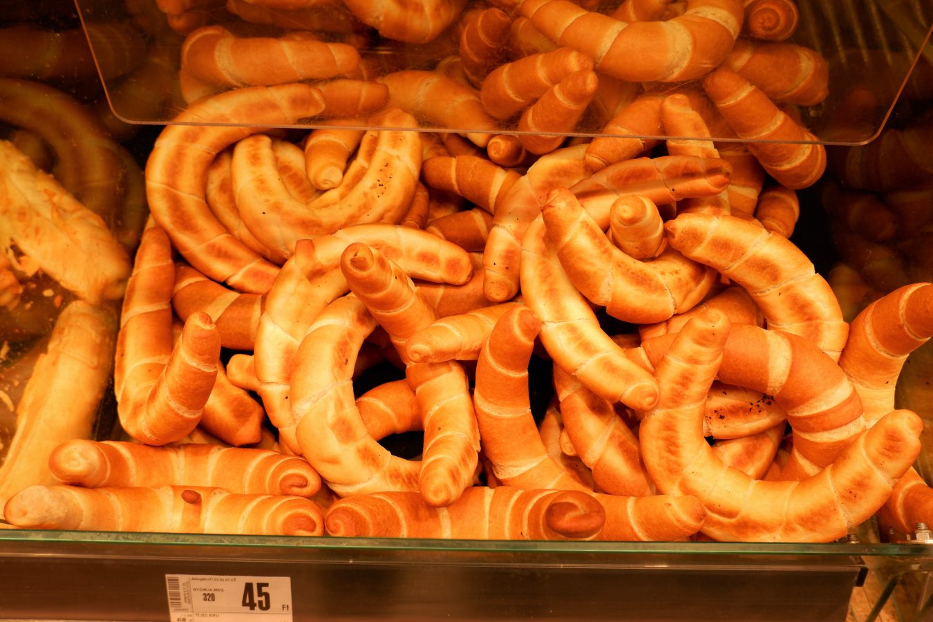bin of kifli hungarian food croissants for sale in a bakery