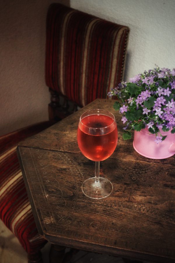 glass of froccs on a wood table in hungary