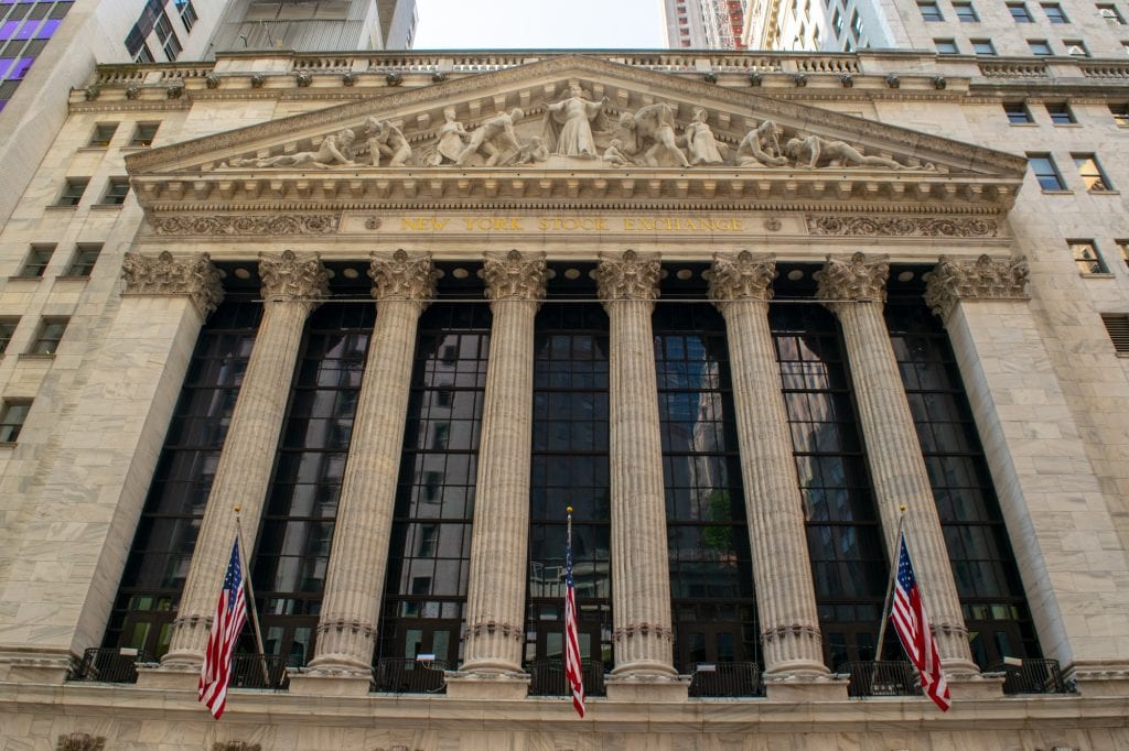 front facade of the new york stock exchange in nyc financial district with columns out front