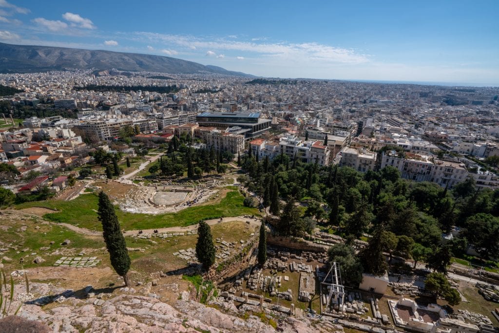 Looking down slopes of Acropolis, theater of Dionysus in distance, 2 day Athens itinerary