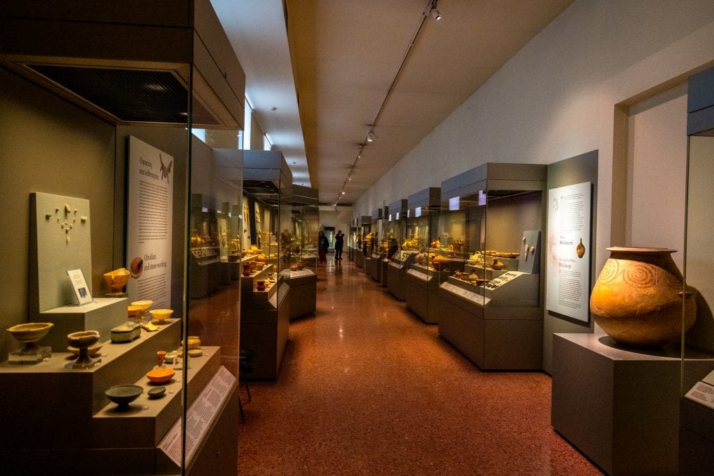 collection of artifacts in glass cases on display in national archaeological museum, an excellent addition to a 2 day athens itinerary