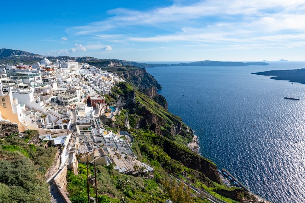 view of fira village on santorini with caldera visible on the right, fira is one of the best places to stay when visiting santorini for a few days