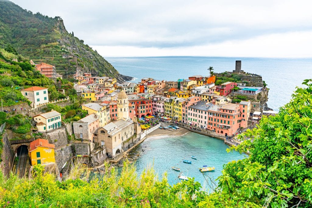 View of Vernazza Harbor from the trail when approaching Vernazza from Monterosso al Mare. This is one of the most instagrammable places in Cinque Terre!