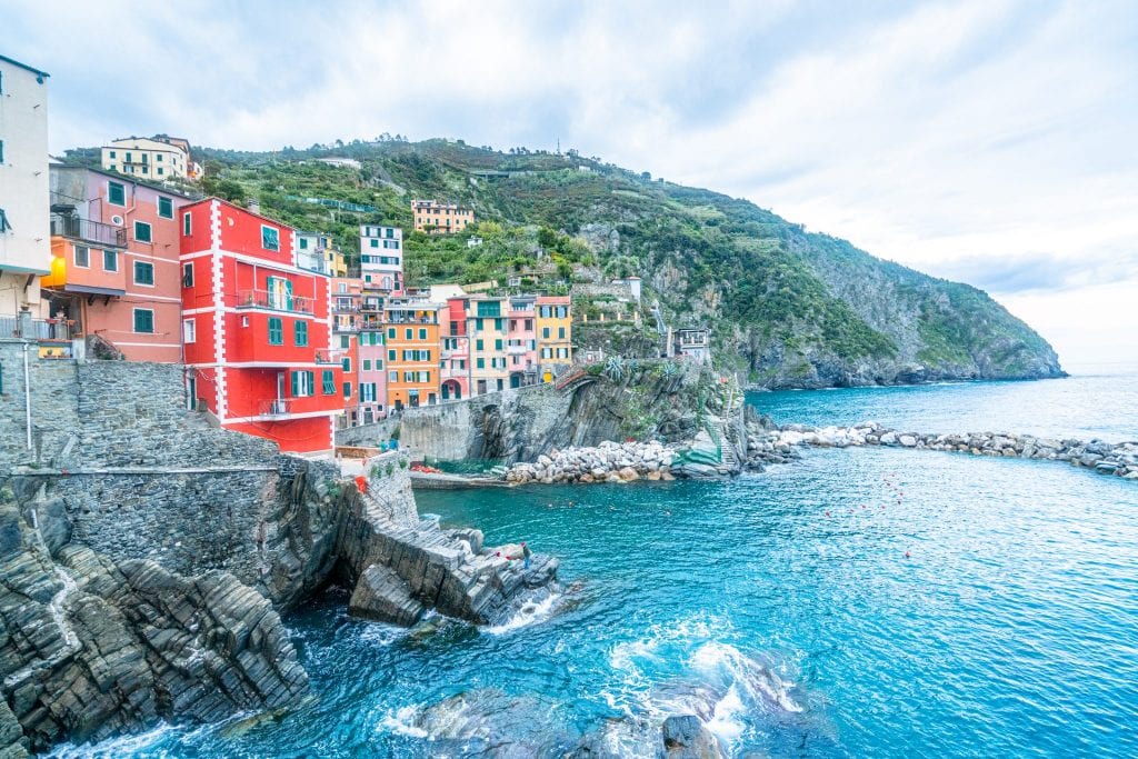 view of riomaggiore from hiking tour taking pictures in cinque terre photo spots