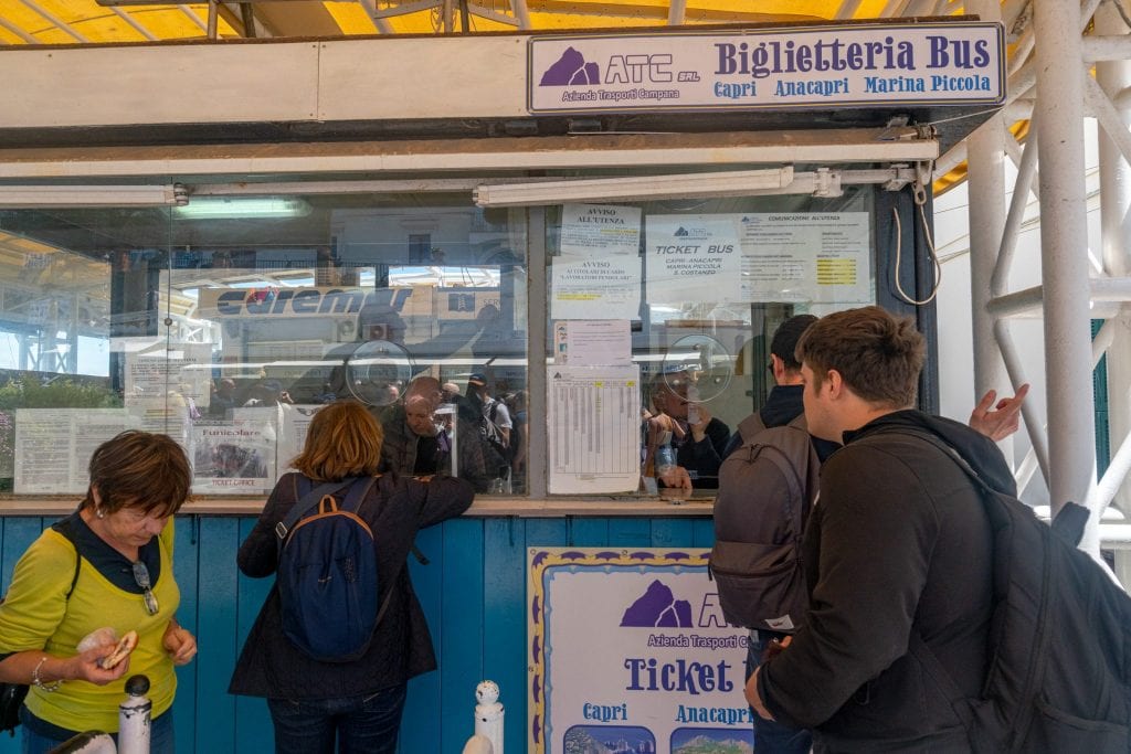 jeremy storm waiting in line at the funicular ticket office at marina grande capri italy