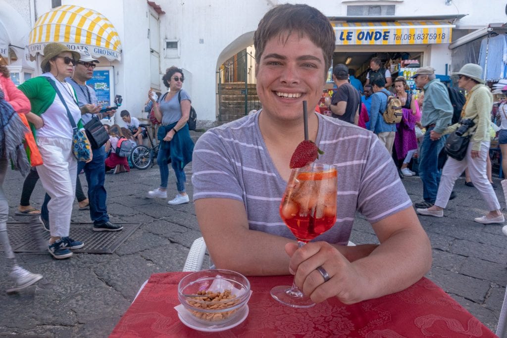 jeremy storm enjoying a spritz at an outfoor bar on capri