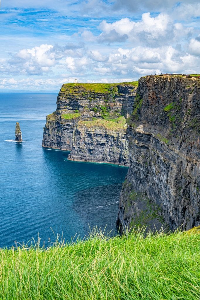 cliffs of moher ireland on a sunny day with the stack visible on the left of the photo