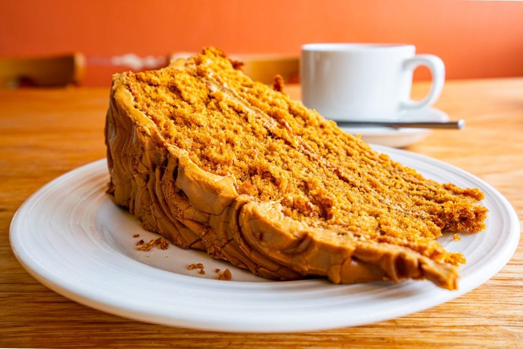 slice of cake served with tea in a cozy pub in ireland