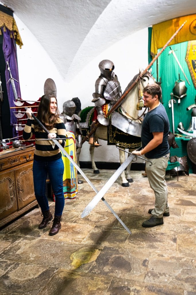 Kate Storm and Jeremy Storm crossing swords in a Belleek Castle Tour