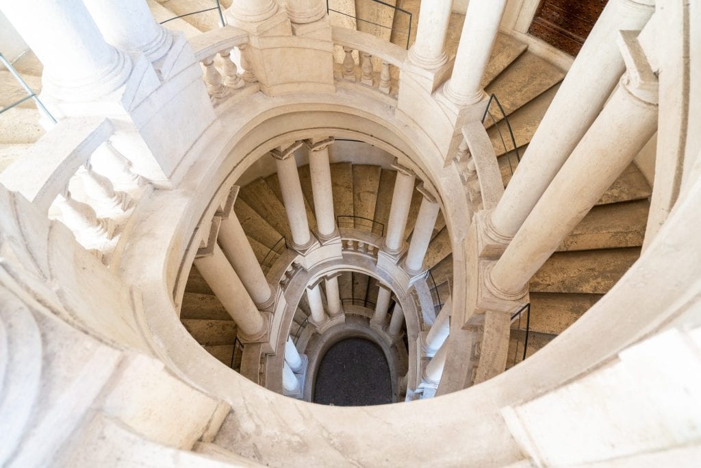 staircase inside palazzo barberini, one of the coolest secret places in rome italy
