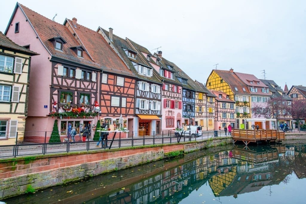 Colorful houses in Colmar France with a canal in the foregroud