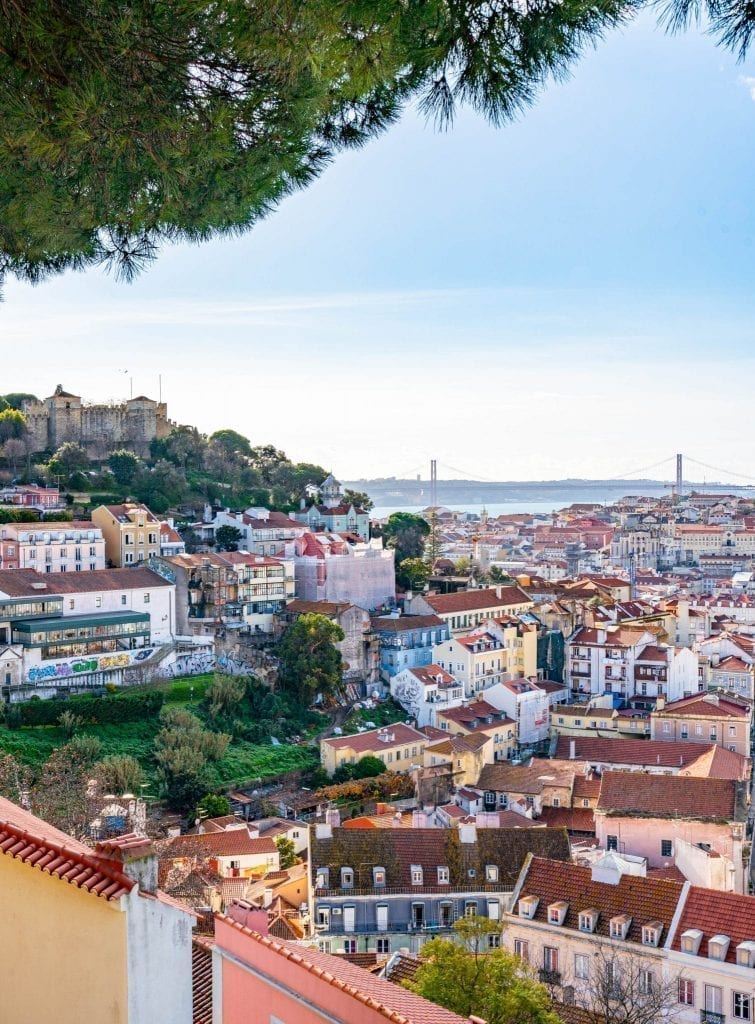 view of lisbon and castelo de sao jorge from miradouro da graca, one of the best lisbon miradouros to visit