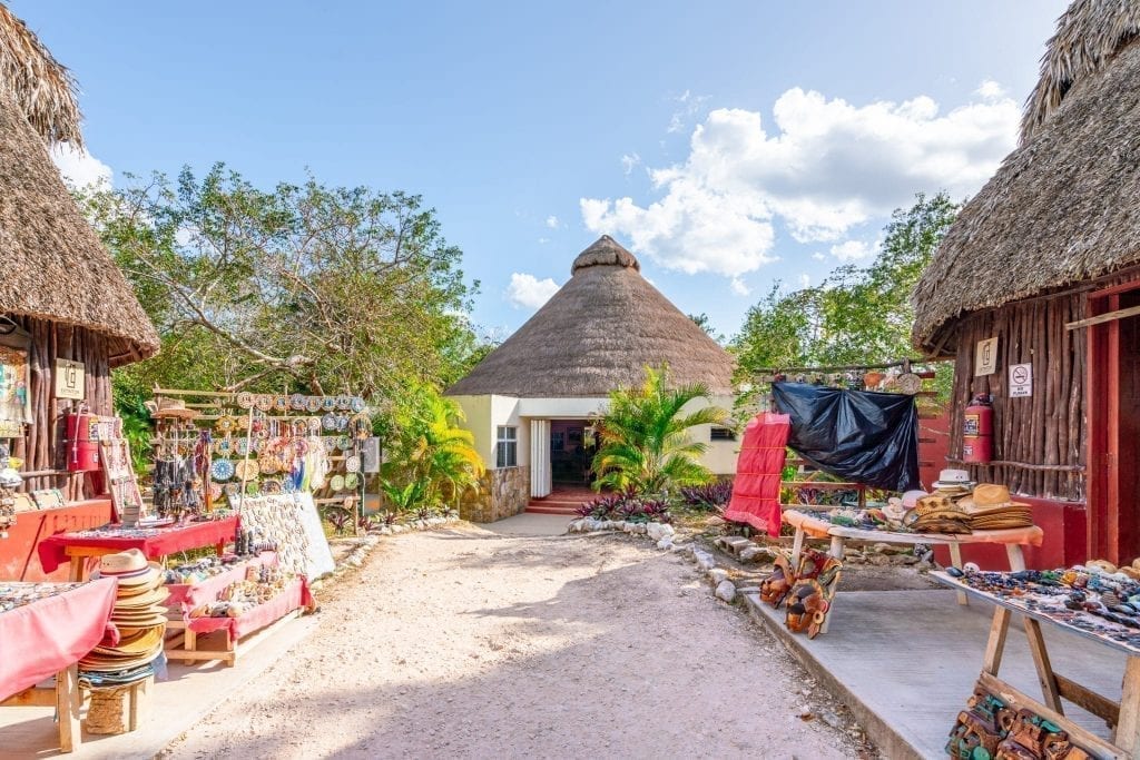 Entrance building to ek balam with souvenirs being sold on either side
