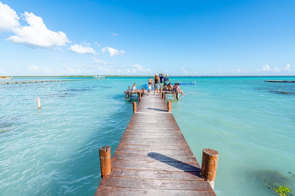 dock at bacalar lagoon leading into the water, a fantastic place to visit when backpacking mexico