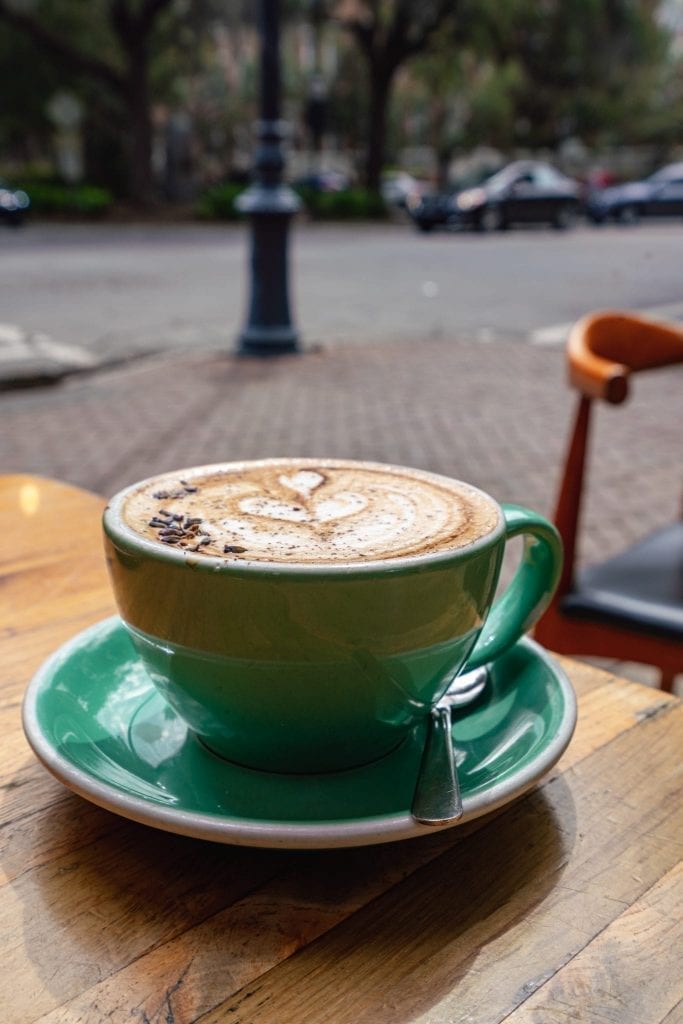spiced lavender mocha latte on outdoor table at collins quarter, a great stop during a day trip to savannah georgia