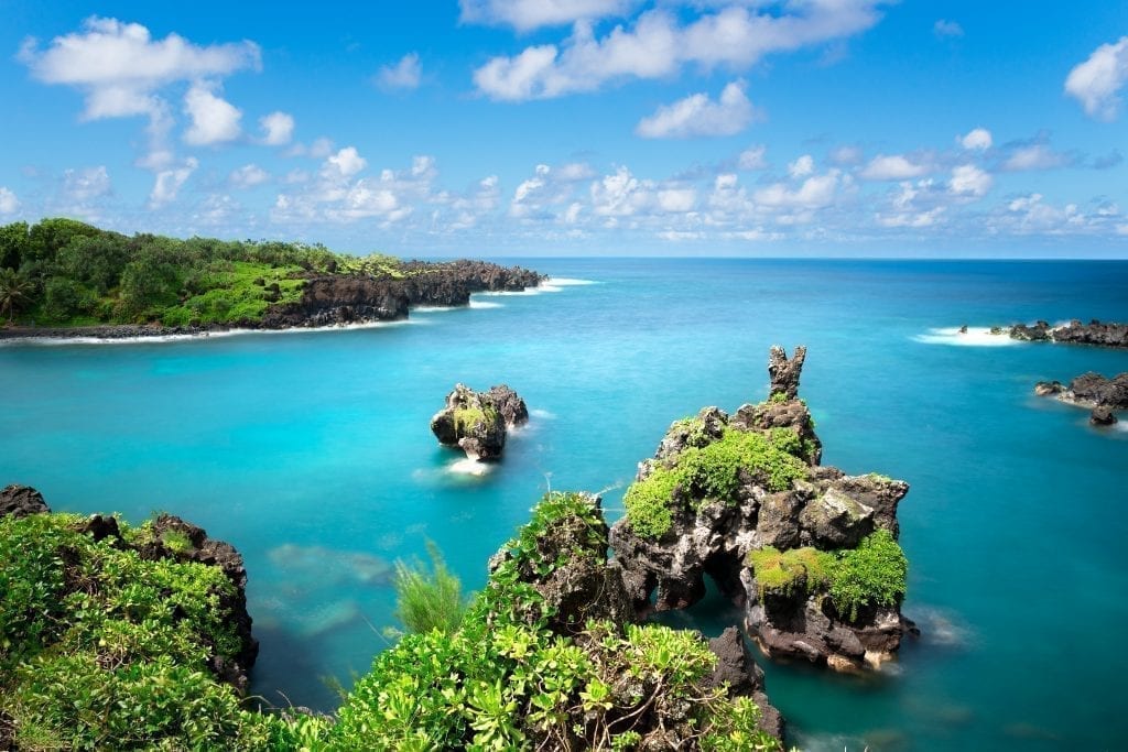 Bright blue water as seen along the Road to Hana in Maui, one of the best USA road trip itinerary ideas