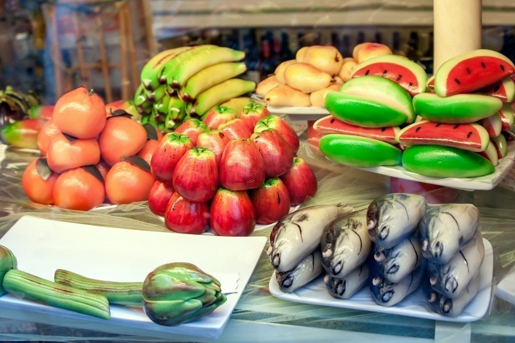 Marzipans shaped as fruits and vegetables in a shop window