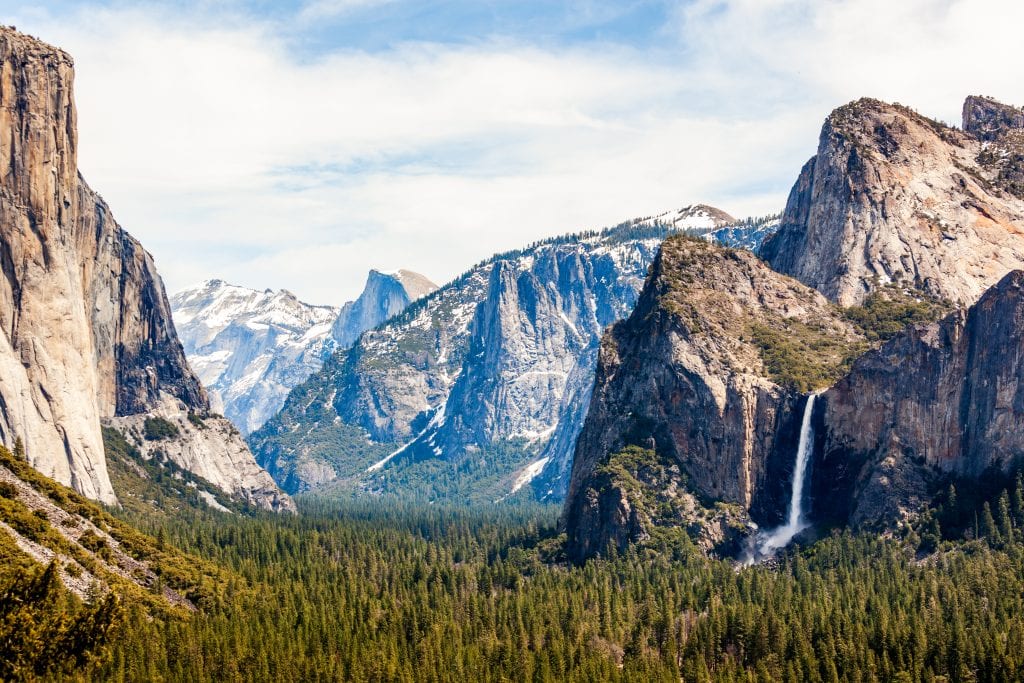 Yosemite national park as seen from above, one of the top national parks in america. yosemite falls is visible in the background