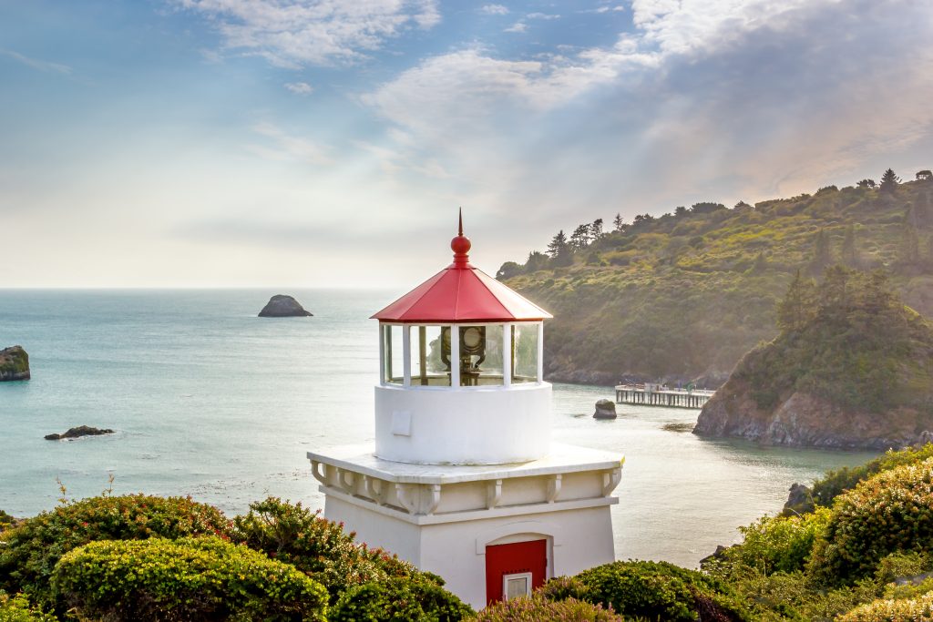 white and red lighthouse in trinidad california, one of the prettiest small towns in america