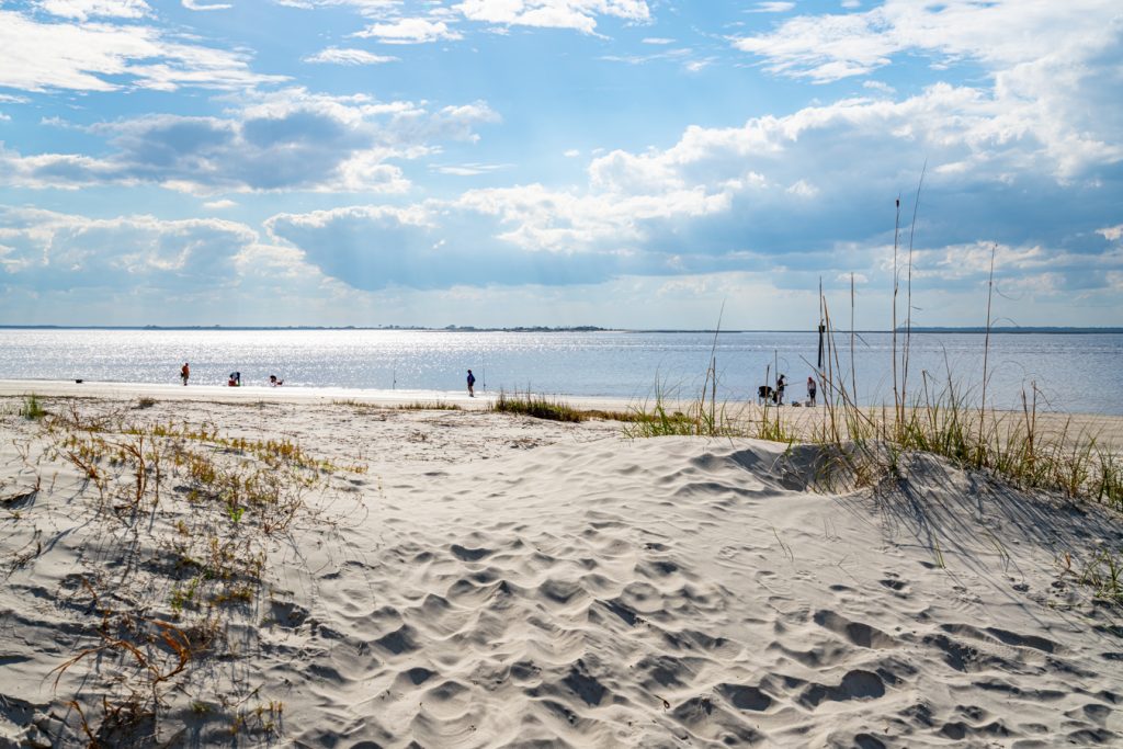 sandy path leading to a calm beach, one of the best attractions jekyll island georgia