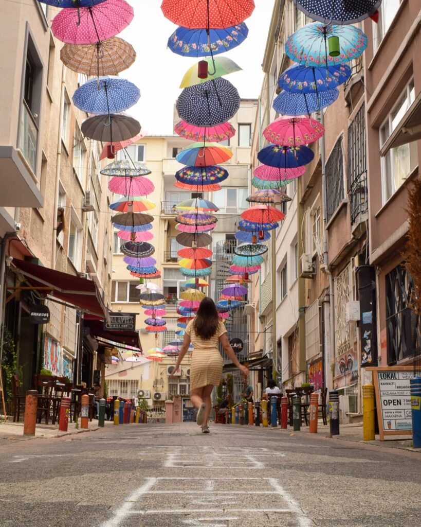 kate storm with a colorful umbrella ceiling in istanbul turkey