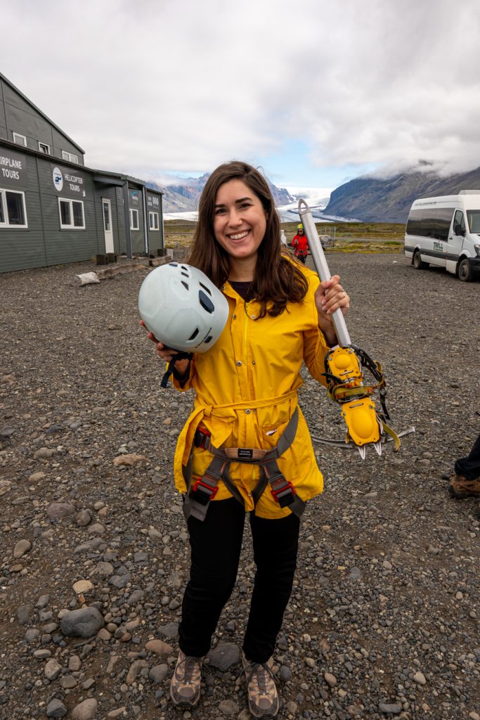 kate storm in a yellow rain jacket with iceland glacier hiking gear