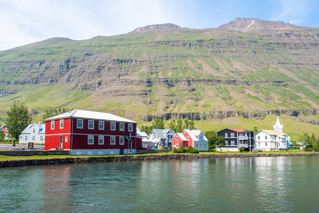 wooden buildings with water in the foreground seydisfjordur iceland