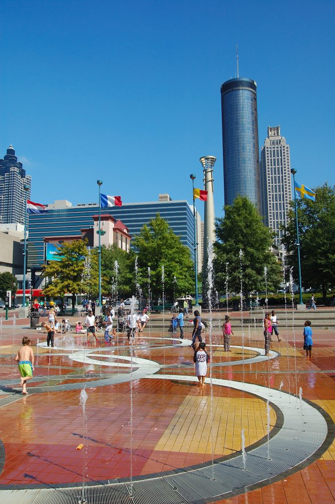 children playing in the fountain of a summer weekend in atlanta georgia centennial park